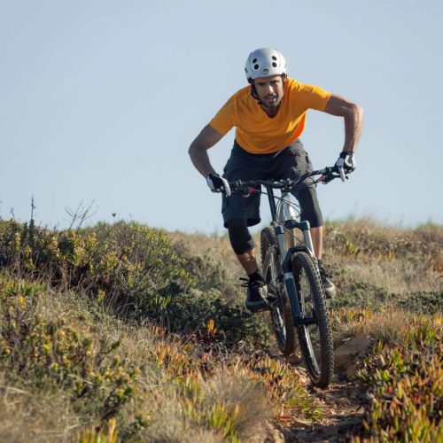 Mountain biker riding dirt trail